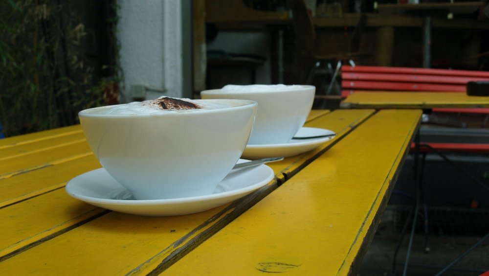 Two cups of coffee on a table