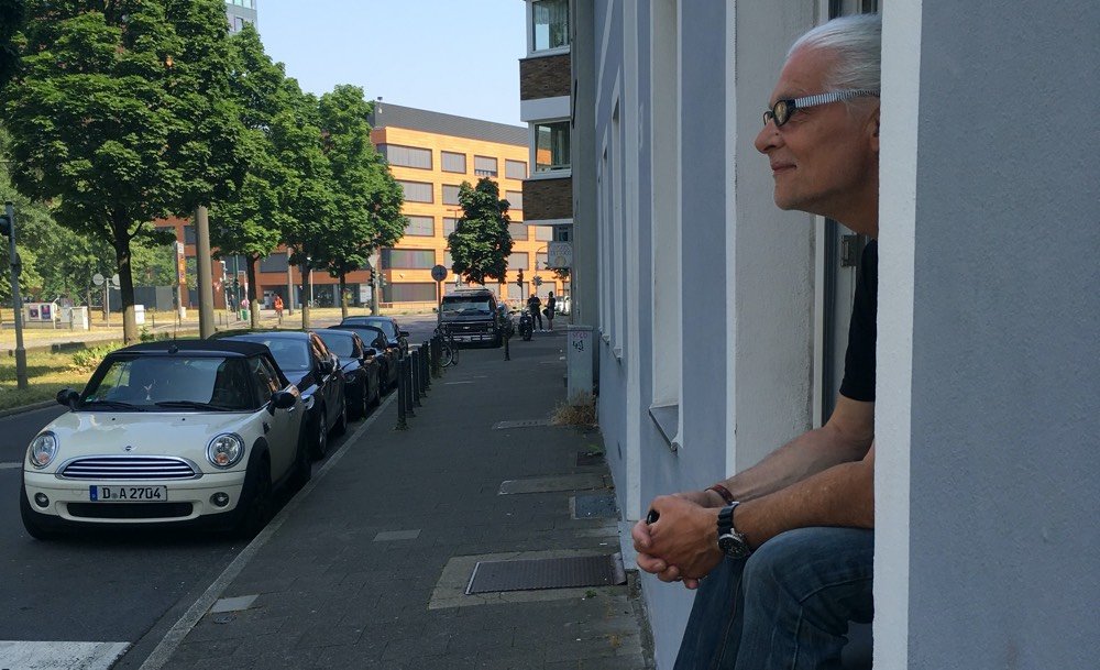 Man sitting on window sill