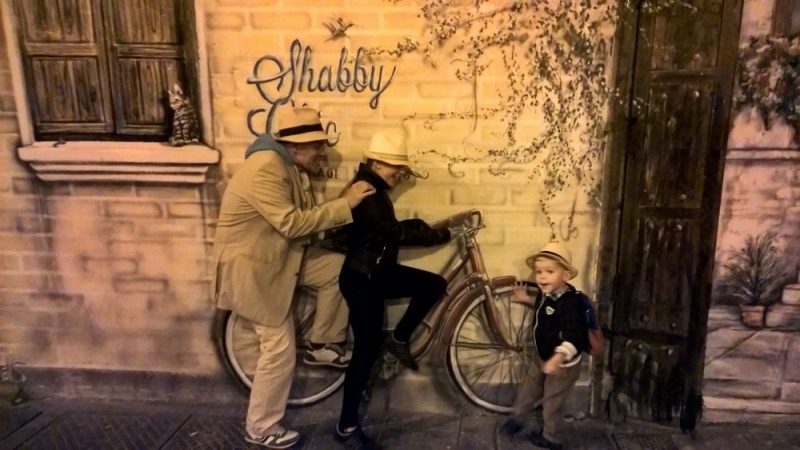 Image of adult, mural, young girl and boy