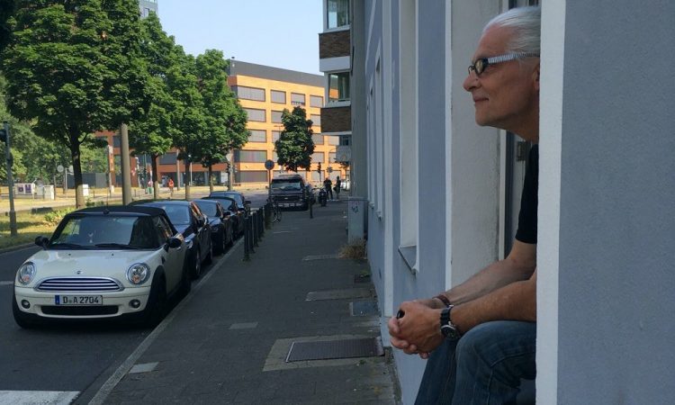 Man sitting on window sill