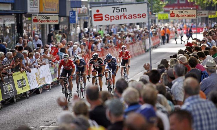 Professional cyclists and spectators